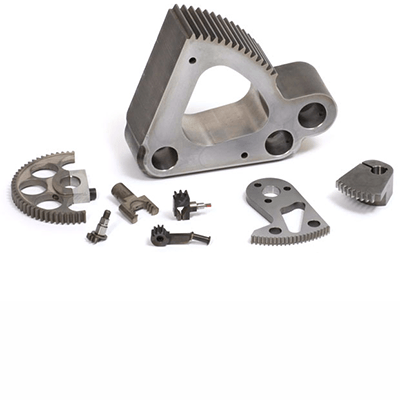 Several precision-machined metal gear segments arranged against a light background.